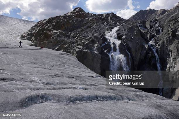 Martin Stocker-Waldhuber, a glaciologist with the Institute for Interdisciplinary Mountain Research of the Austrian Academy of Sciences, walks...