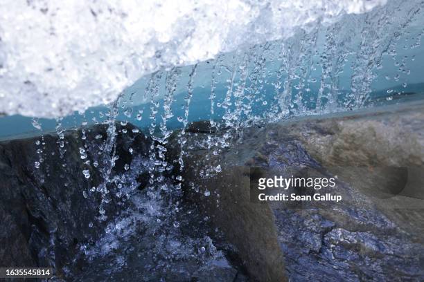 Water pours from the melting upper plateau of the Gepatschferner glacier on August 22, 2023 above Kaunertal, Austria. Martin Stocker-Waldhuber, a...