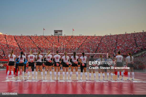 The Nebraska Cornhuskers stand on the court during introductions before the game against the Omaha Mavericks at Memorial Stadium on August 30, 2023...