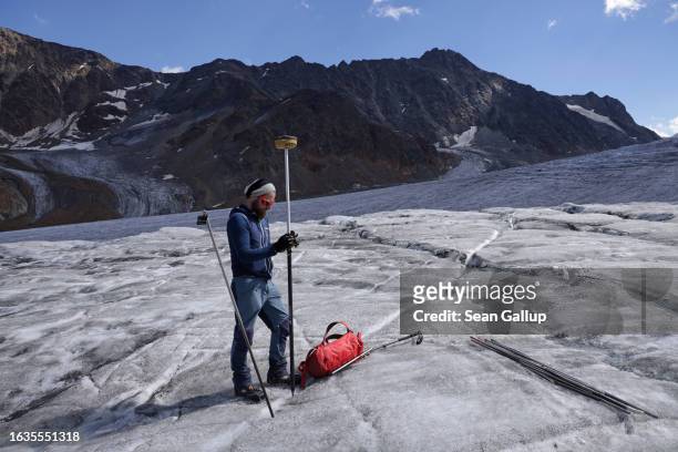 Martin Stocker-Waldhuber, a glaciologist with the Institute for Interdisciplinary Mountain Research of the Austrian Academy of Sciences, uses a GPS...