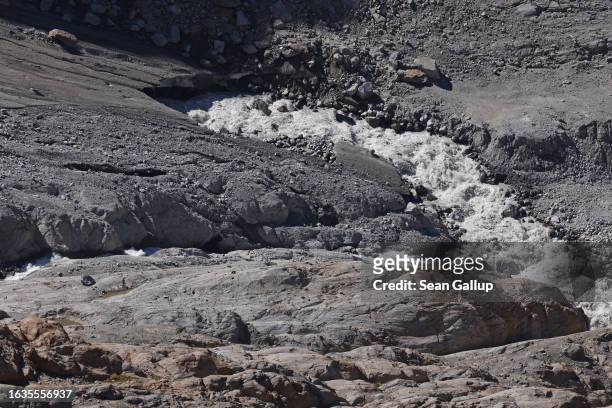 Water rushes from the mouth of the melting and dirt covered Gepatschferner glacier on August 22, 2023 above Kaunertal, Austria. Martin...