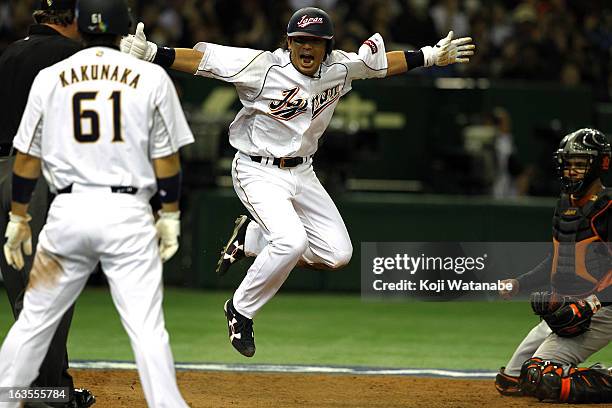 Infielder Nobuhiro Matsuda of Japan celebrates after scoring in the bottom half of the eighth inning during the World Baseball Classic Second Round...