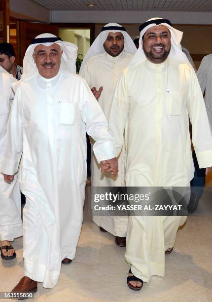 Kuwaiti Finance Minister Mustafa al-Shamali arrives to hold a press conference with MP Yussef al-Zalzalah, chairman of the parliament's financial and...