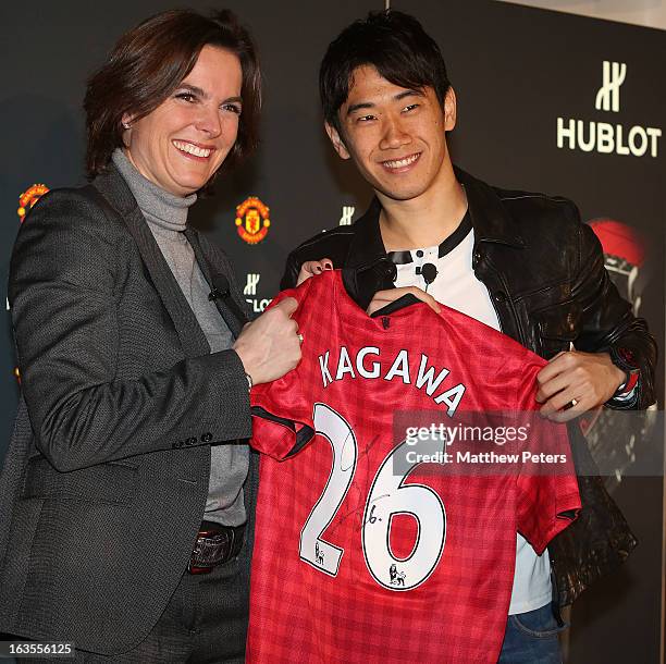 Hublot marketing director Valerie Servageon Grande and Shinji Kagawa of Manchester United take part in a press conference before taking part in a...