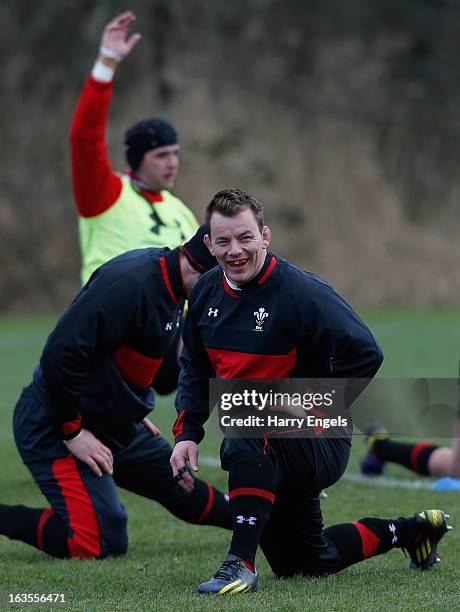 Wales hooker Matthew Rees stretches during a Wales training session at the Vale on March 12, 2013 in Cardiff, Wales.