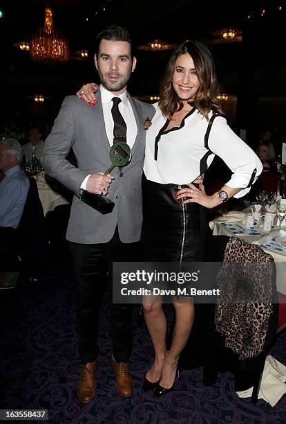 Dave Berry and Lisa Snowdon, winners of the Radio/Digital Radio Programme award, attend the TRIC Television and Radio Industries Club Awards at The...