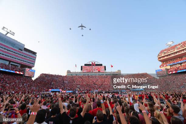 Flyover takes place during the national anthem before the match between the Nebraska Cornhuskers and the Omaha Mavericks at Memorial Stadium on...