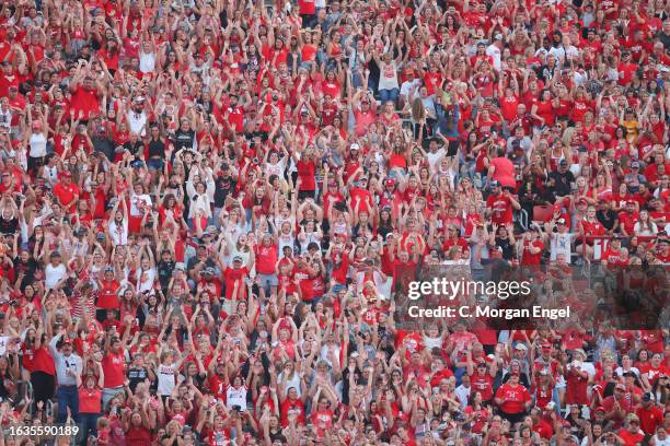 Spectators do the wave during a break in play between the Nebraska Cornhuskers and the Omaha Mavericks at Memorial Stadium on August 30, 2023 in...