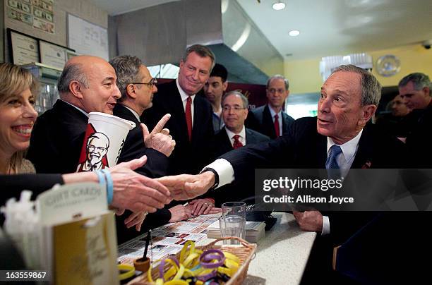 New York City Mayor Michael Bloomberg attends a press conference about the health impacts of sugar at Lucky's restaurant, which voluntarily adopted...