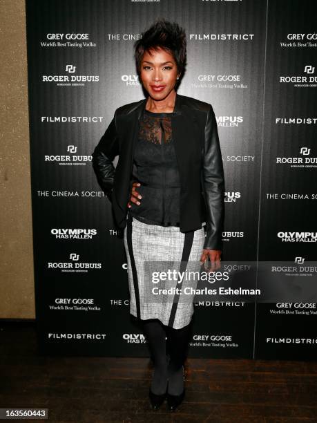 Actress Angela Bassett attends The Cinema Society with Roger Dubuis and Grey Goose screening of FilmDistrict's "Olympus Has Fallen" at the Tribeca...