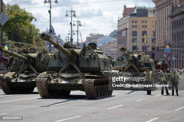 Police officers are on duty on Khreschatyk Street during an exhibition of Russian military equipment destroyed by the Ukrainian army on August 23,...