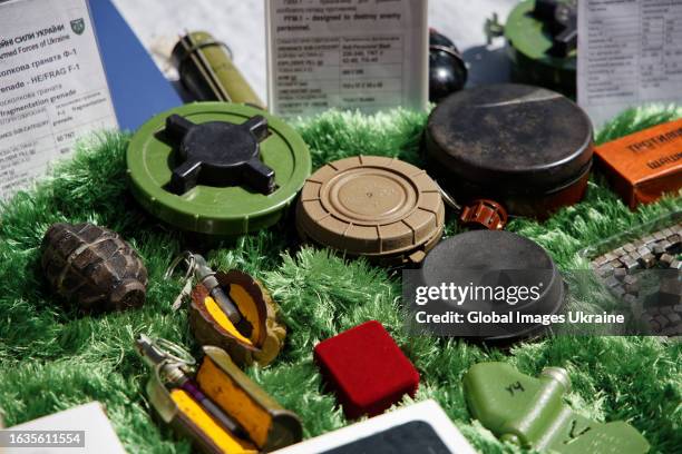 Various types of Russian hand grenades and land mines are displayed on Khreschatyk Street during an exhibition on August 23, 2023 in Kyiv, Ukraine....