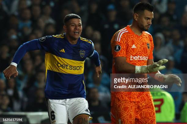 Boca Juniors' defender Marcos Rojo and goalkeeper Sergio Romero celebrates after winning the penalty shoot-out of the all-Argentine Copa Libertadores...