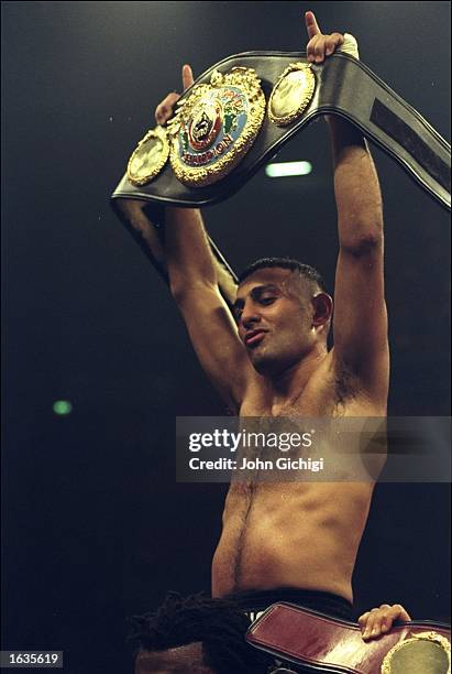 Naseem Hamed holds up his title belt after comfortably defeating Wilfredo Vazquez during the WBO Featherweight Championship fight held at the...