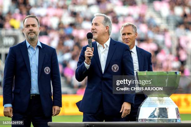 Inter Miami's managing owner Jorge Mas speaks alongside Inter Miami's managing owner Jose Mas as they present the Leagues Cup trophy ahead of the...