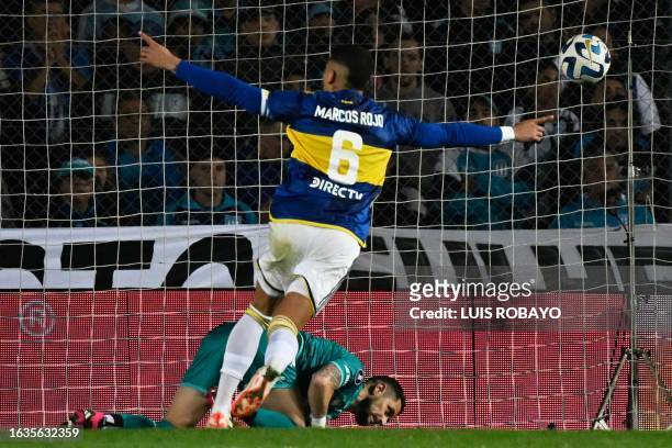Boca Juniors' defender Marcos Rojo celebrates after scoring the last goal past Racing's Chilean goalkeeper Gabriel Arias during the penalty shoot-out...
