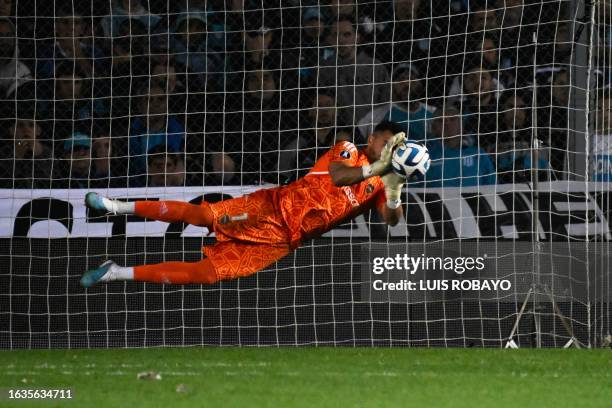 Boca Juniors' goalkeeper Sergio Romero stops the shot by Racing's defender Gonzalo Piovi during the penalty shoot-out of the all-Argentine Copa...