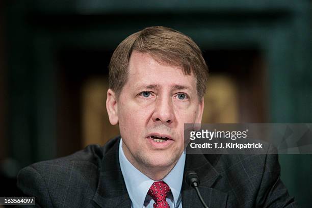 Richard Cordray, nominee for director of the Consumer Financial Protection Bureau, testifies at a confirmation hearing before the Senate Committee on...