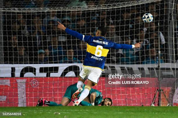Boca Juniors' defender Marcos Rojo celebrates after scoring past Racing's Chilean goalkeeper Gabriel Arias to win the penalty shoot-out of the...