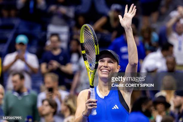 Denmark's Caroline Wozniacki celebrates after victory over Czech Republic's Petra Kvitova during the US Open tennis tournament women's singles second...