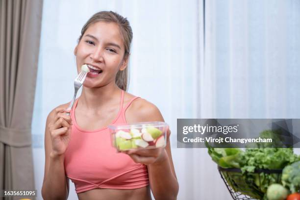 healthy female eat fruit - cutting green apple stock pictures, royalty-free photos & images