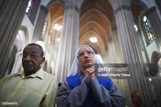 Nun worships during Mass at the Se Cathedral, the cathedral of the Roman Catholic Archbishop of Sao Paulo, Cardinal Odilo Pedro Scherer, on March 12,...