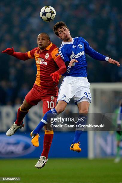 Felipe Melo of Galatasaray and Roman Neustaedter of Schalke go up for a header during the UEFA Champions League round of 16 second leg match between...
