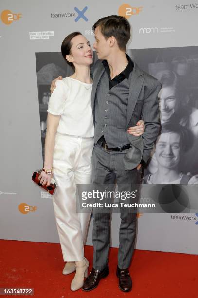 Katharina Schuettler and Tom Schilling attend the Premiere of 'Unsere Muetter, Unsere Vaeter' at the Astor Film Lounge on March 12, 2013 in Berlin,...