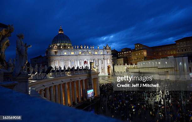 Pilgrims gather in St Peter's Square as cardinals attend mass before entering the conclave on March 12, 2013 in Vatican City, Vatican. Pope Benedict...