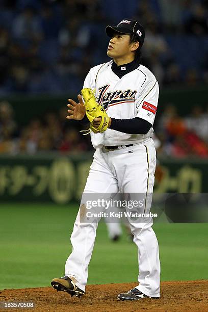 Pitcher Kazuhisa Makita of Japan celebrates after winning the World Baseball Classic Second Round Pool 1 game between Japan and the Netherlands at...