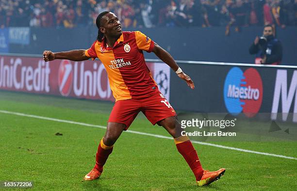 Didier Drogba of Galatasaray celebrates after winning the UEFA Champions League round of 16 second leg match between FC Schalke 04 and Galatasaray AS...