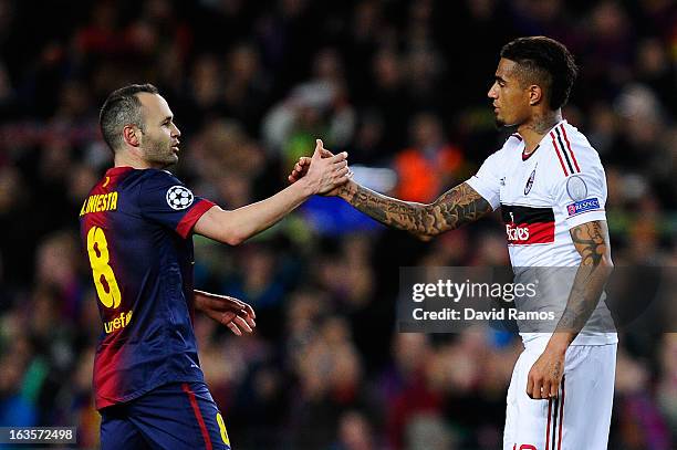 Andres Iniesta of FC Barcelona shakes hands with Kevin-Prince Boateng of AC Milan at the end of the UEFA Champions League round of 16 second leg...