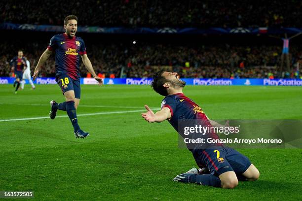 David Villa of FC Barcelona celebrates scoring their third goal with teammate Jordi Alba during the UEFA Champions League Round of 16 second leg...