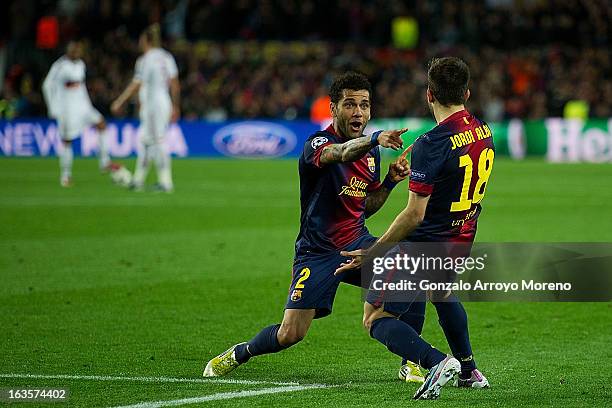 Jordi Alba of FC Barcelona celebrates scoring their fourth goal with teammate Dani Alves during the UEFA Champions League Round of 16 second leg...