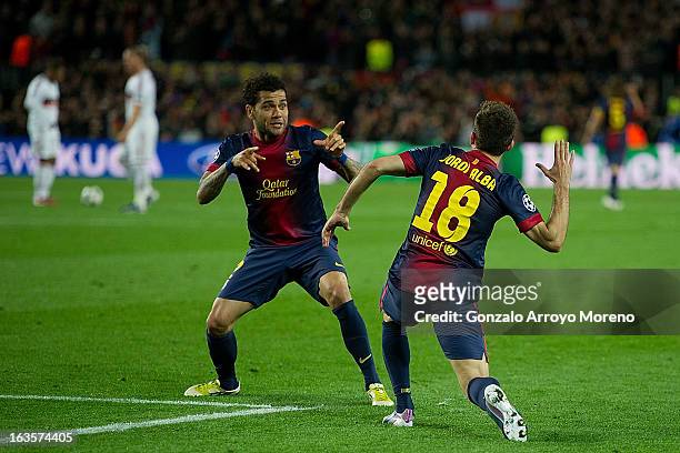 Jordi Alba of FC Barcelona celebrates scoring their fourth goal with teammate Dani Alves during the UEFA Champions League Round of 16 second leg...