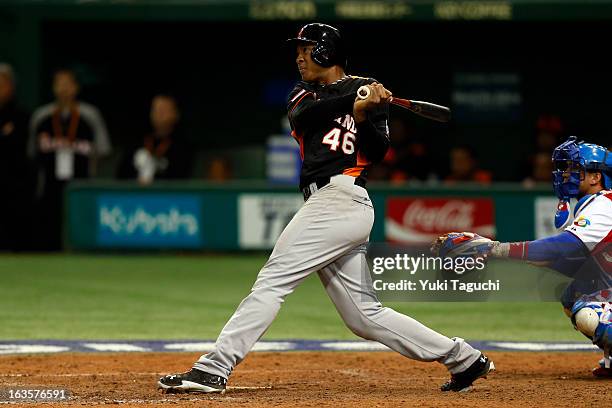 Jonathan Schoop of Team Netherlands hits a three-run home run in the sixth inning during Pool 1, Game 1 in the second round of the 2013 World...