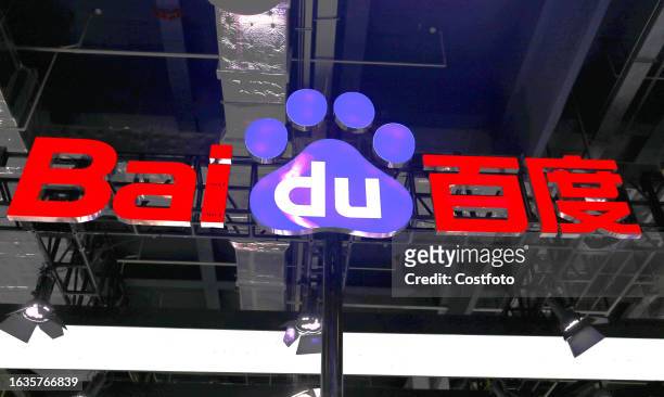 Visitors visit Baidu's "ERNIE Bot" artificial intelligence large model booth at the 2023 World Artificial Intelligence Conference in Shanghai, China,...