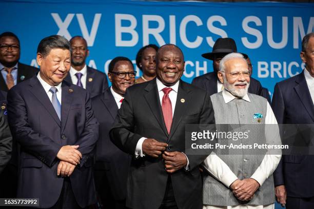 South African President Cyril Ramaphosa with fellow BRICS leaders President of China Xi Jinping and Prime Minister of India Narendra Modi pose for a...