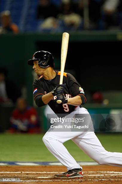 Andrelton Simmons of Team Netherlands singles in the bottom of the third inning against Team Cuba during Pool 1, Game 5 in the second round of the...