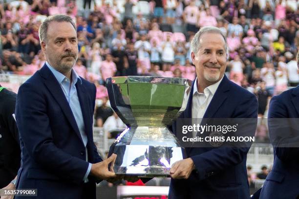 Inter Miami's managing owner Jose Mas and Inter Miami's managing owner Jorge Mas pose with the Leagues Cup trophy ahead of the Major League Soccer...