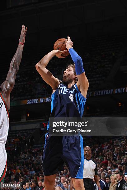 Dirk Nowitzki of the Dallas Mavericks shoots against Larry Sanders of the Milwaukee Bucks on March 12, 2013 at the BMO Harris Bradley Center in...