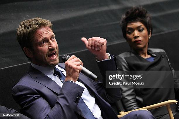 Actors Gerard Butler and Angela Bassett attend the "Olympus Has Fallen" screening Q & A session at AMC Loews Georgetown 14 on March 12, 2013 in...