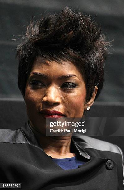 Actress Angela Bassett attends the "Olympus Has Fallen" screening Q & A session at AMC Loews Georgetown 14 on March 12, 2013 in Washington, DC.