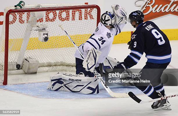 Evander Kane of the Winnipeg Jets scores a goal against James Reimer of the Toronto Maple Leafs during third period action on March 12, 2013 at the...