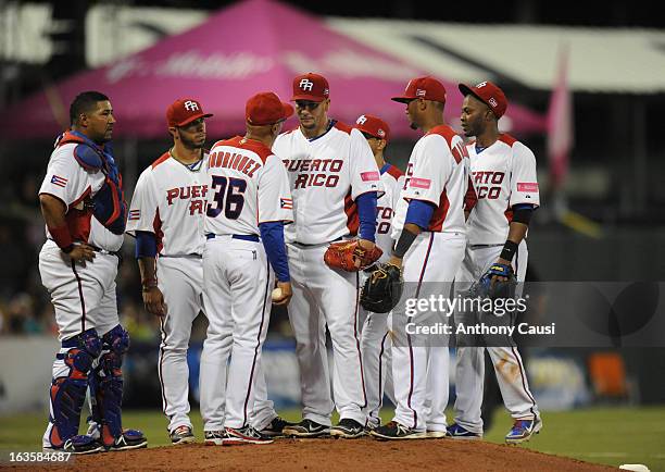 Edwin Rodriguez manager of Puerto Rico makes a pitching change against Dominican Republic in the Pool C, Game 6 of the first round of the 2013 World...