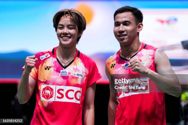 Dechapol Puavaranukroh and Sapsiree Taerattanachai of Thailand celebrate the victory in the Mixed Doubles Third Round match against Rinov Rivaldy and...