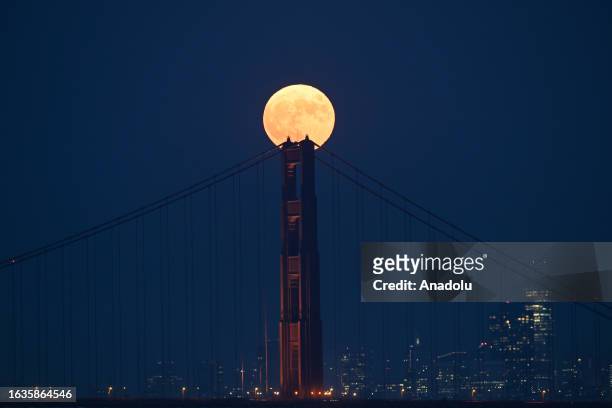 Super moon known as 'Blue Moon' rises over the Golden Gate Bridge in San Francisco, California, United States on August 30, 2023.