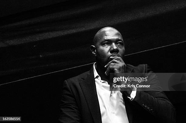 Antoine Fuqua speaks during the "Olympus Has Fallen" screening at AMC Loews Georgetown 14 on March 12, 2013 in Washington, DC.