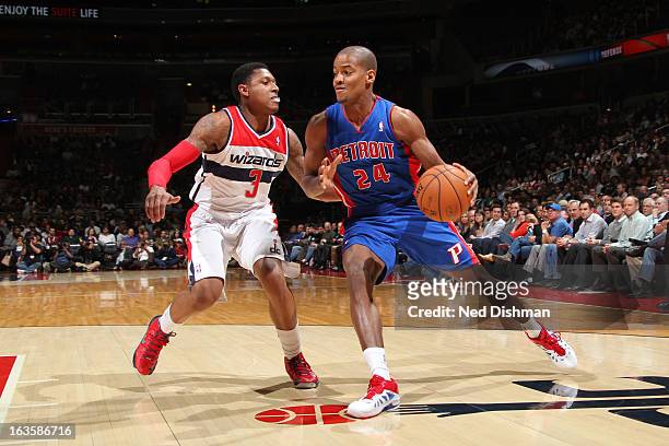 Kim English of the Detroit Pistons drives to the basket against Bradley Beal of the Washington Wizards at the Verizon Center on February 27, 2013 in...