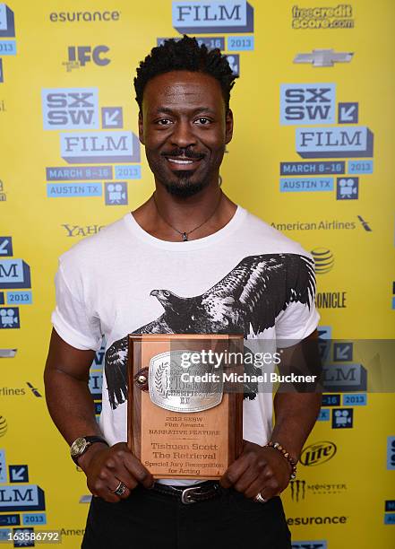 Actor Tishuan Scott, winner of the Special Grand Jury Prize for Acting, poses with his award at the 2013 SXSW Film Awards during the 2013 SXSW Music,...